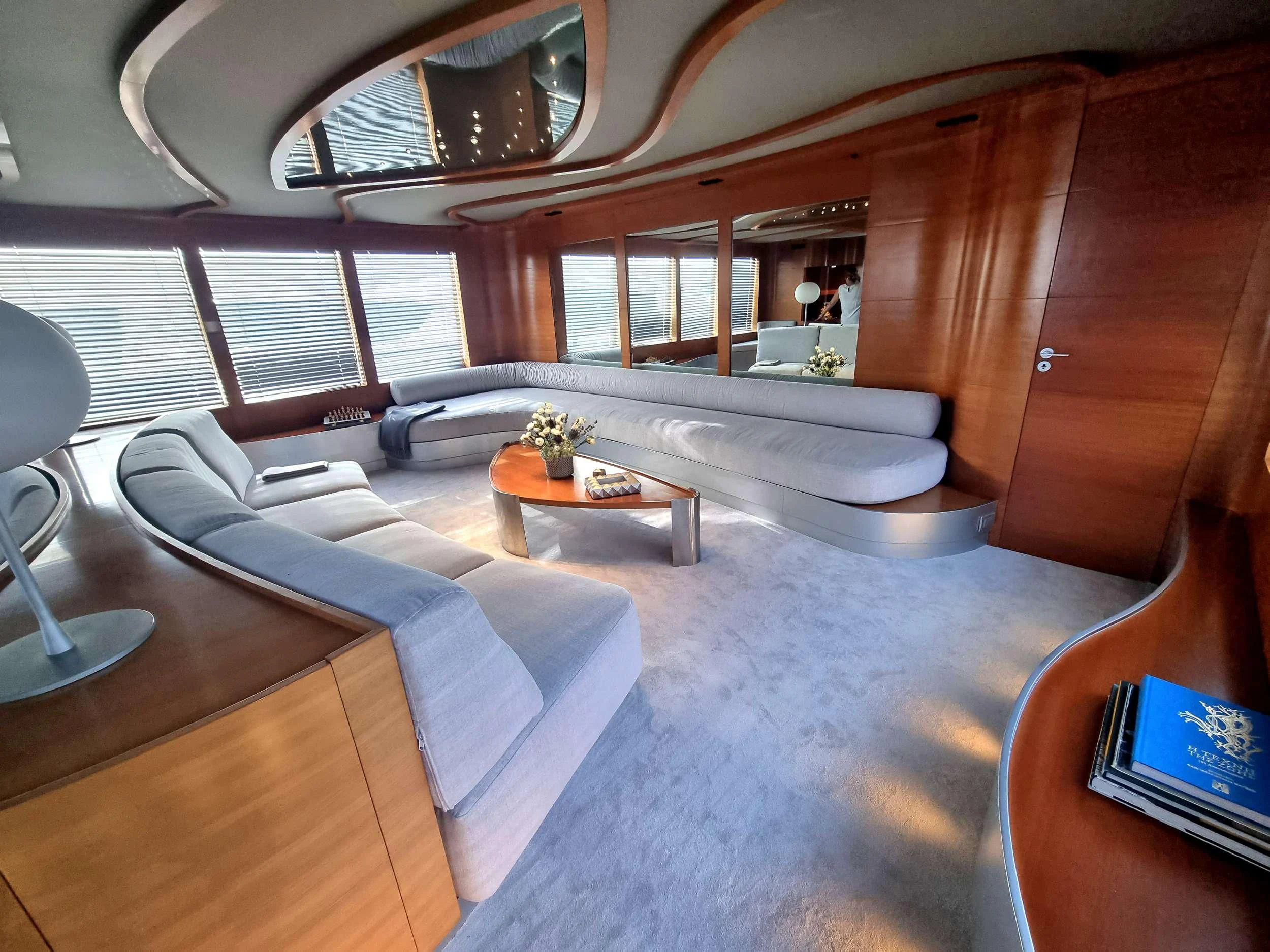 a room with a couch and a table aboard SATORI Yacht for Sale