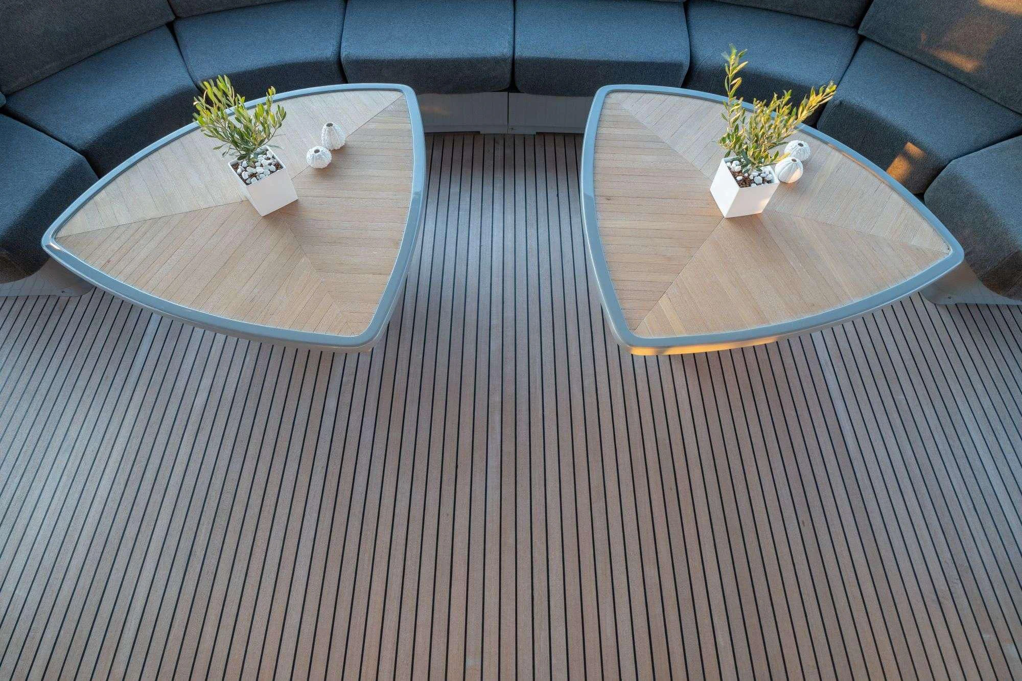 a coffee table with a plant on it aboard SATORI Yacht for Sale