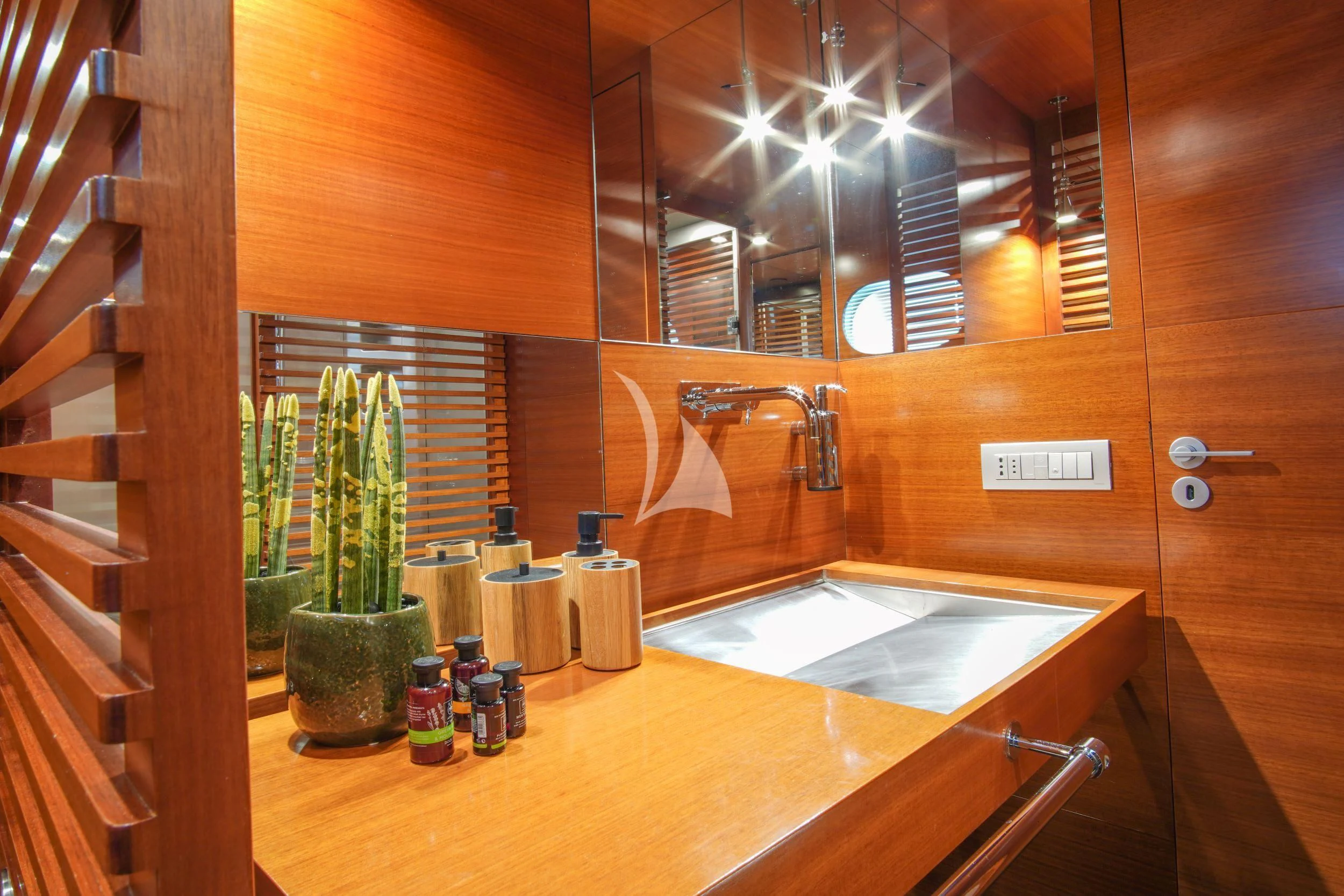 a bathroom with a sink and a mirror aboard SATORI Yacht for Sale