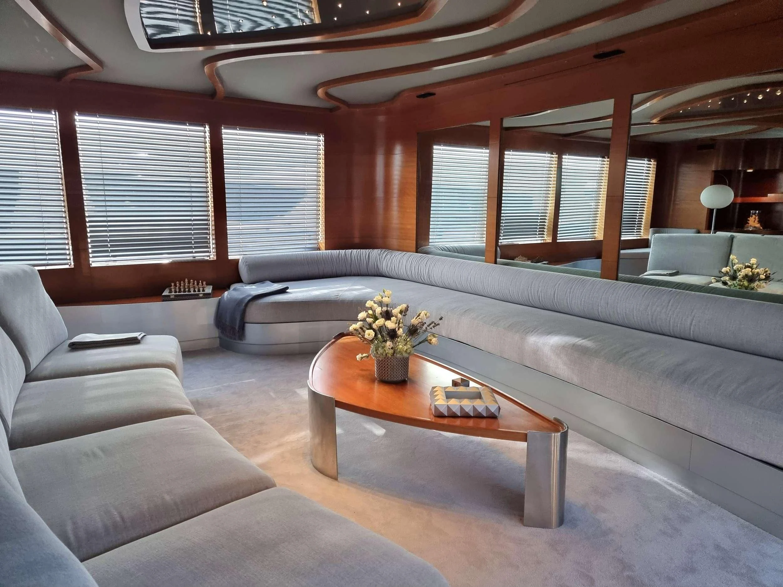 a living room with a large sofa aboard SATORI Yacht for Sale