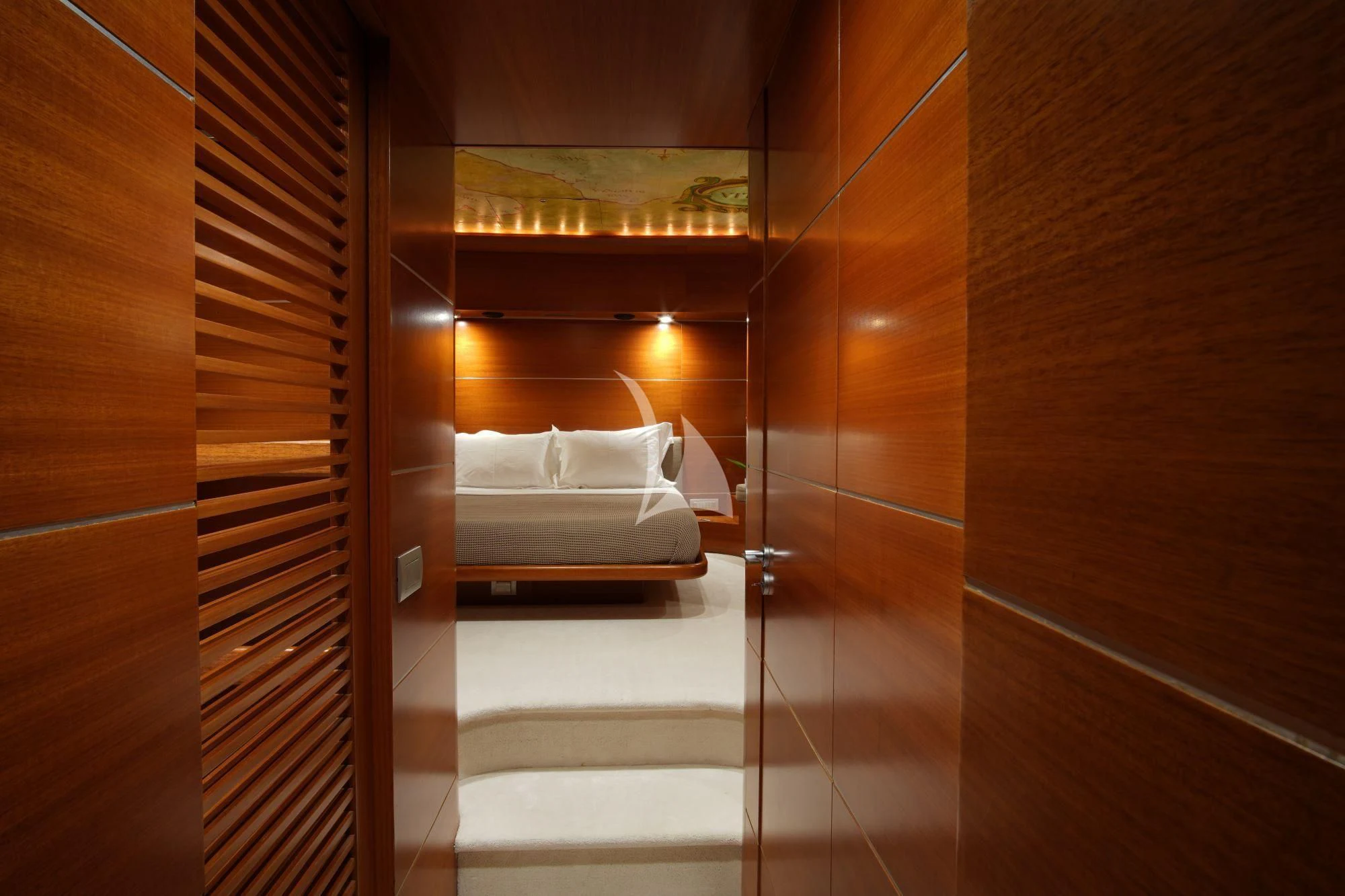 a room with a bed and a window aboard SATORI Yacht for Sale