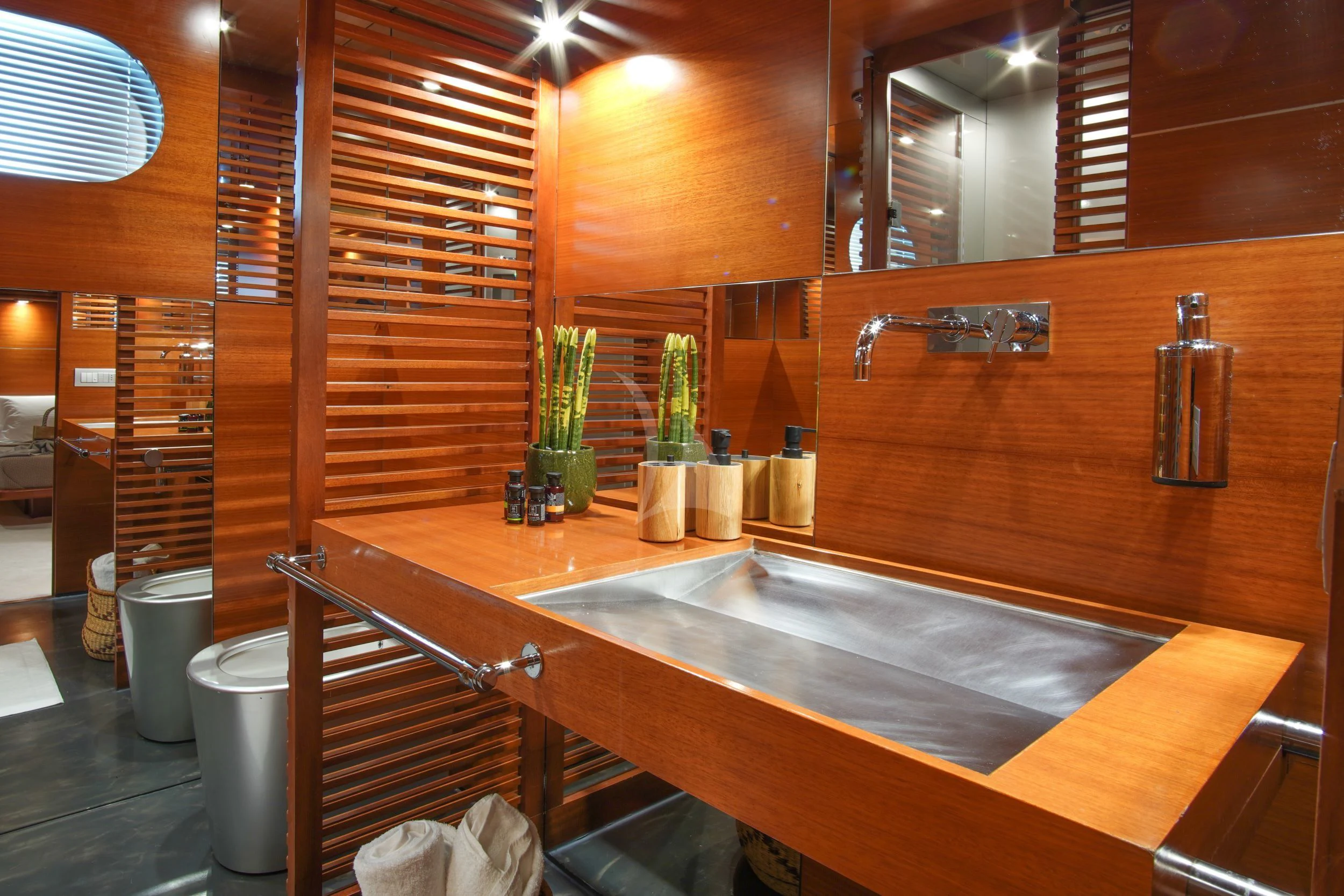 a kitchen with wooden cabinets aboard SATORI Yacht for Sale