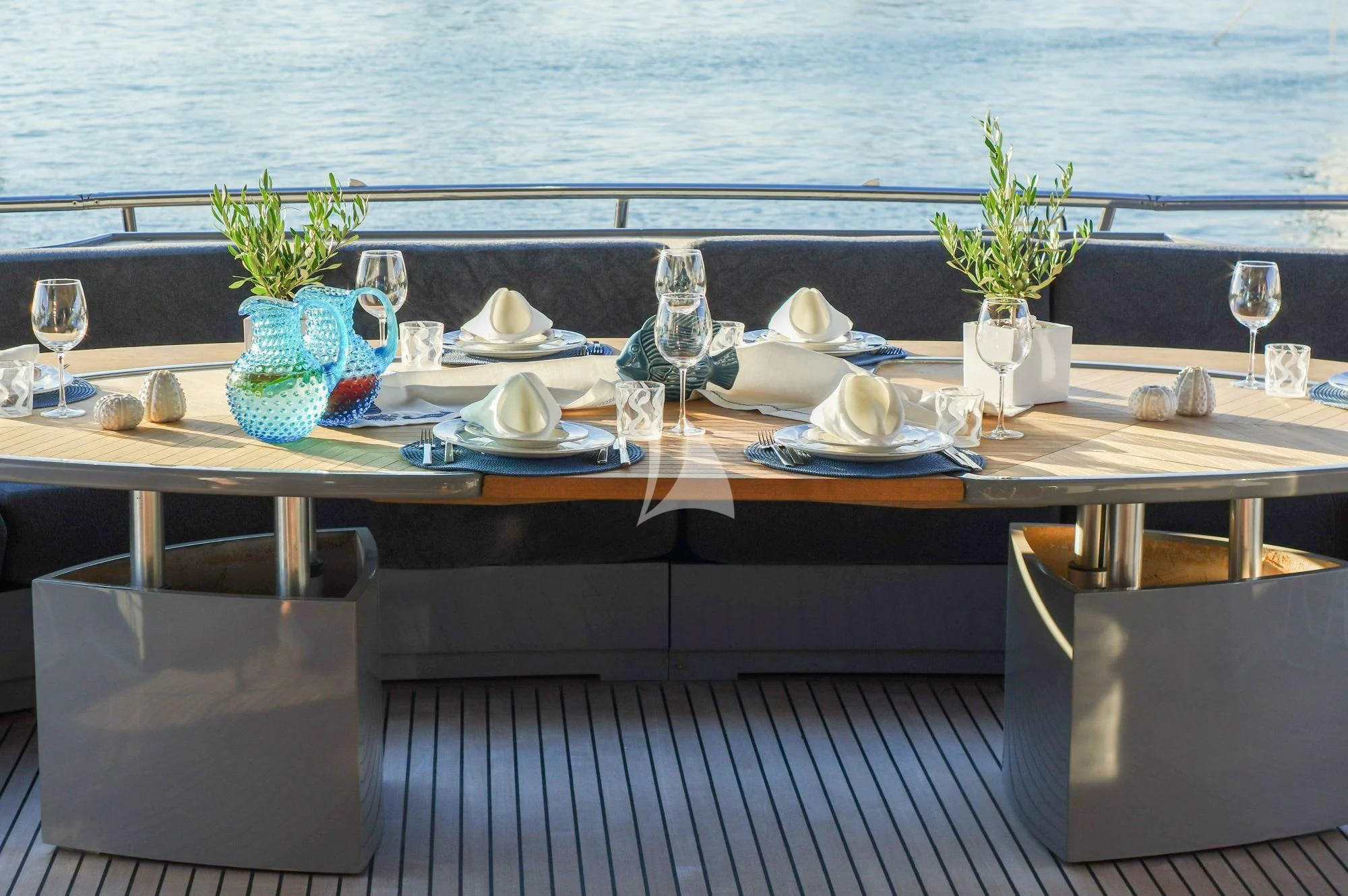 a table with plates and glasses on it aboard SATORI Yacht for Sale