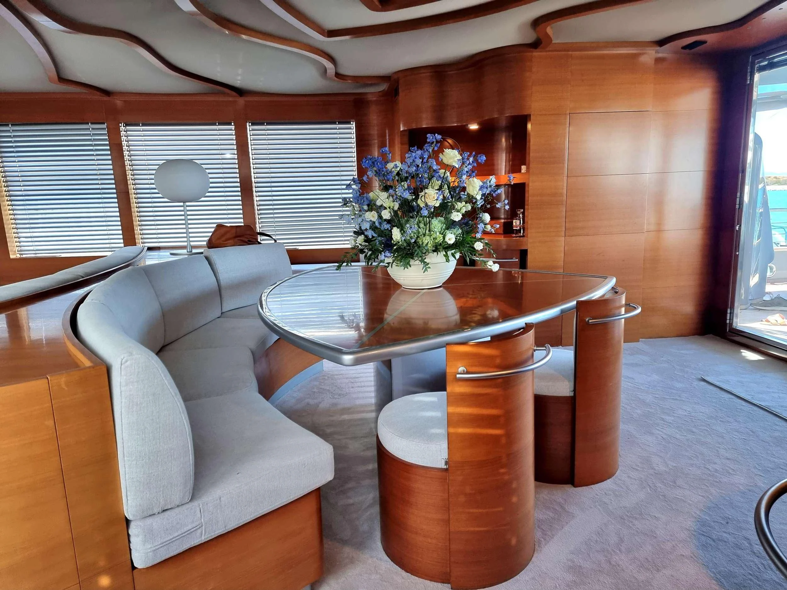 a table and chairs in a room aboard SATORI Yacht for Sale