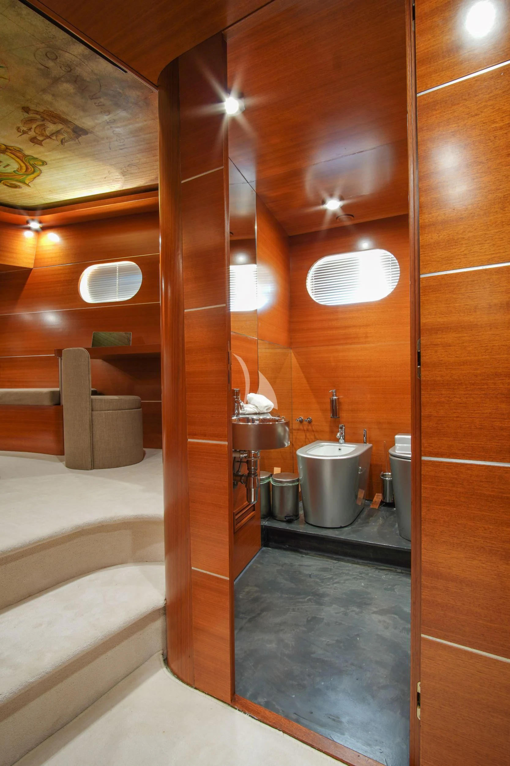 a bathroom with a wood wall aboard SATORI Yacht for Sale