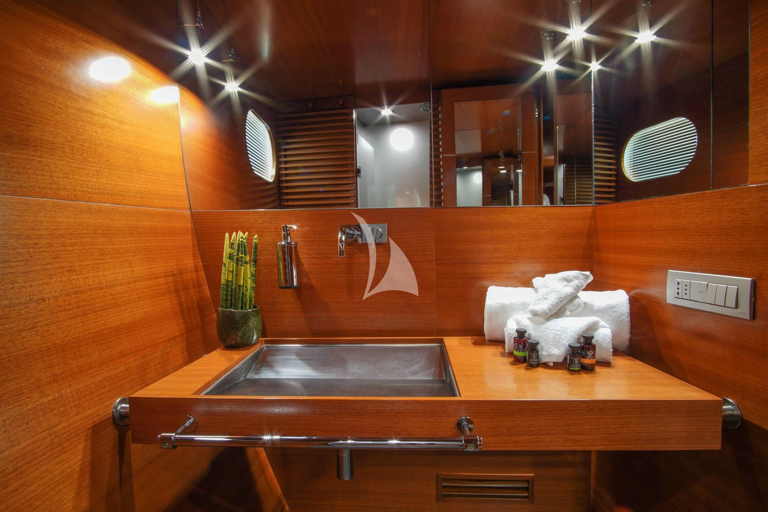 a bathroom with a large mirror aboard SATORI Yacht for Sale