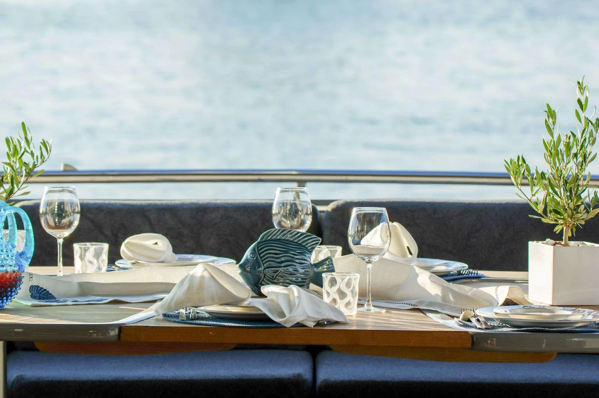 a table with a cloth and glasses on it aboard SATORI Yacht for Sale