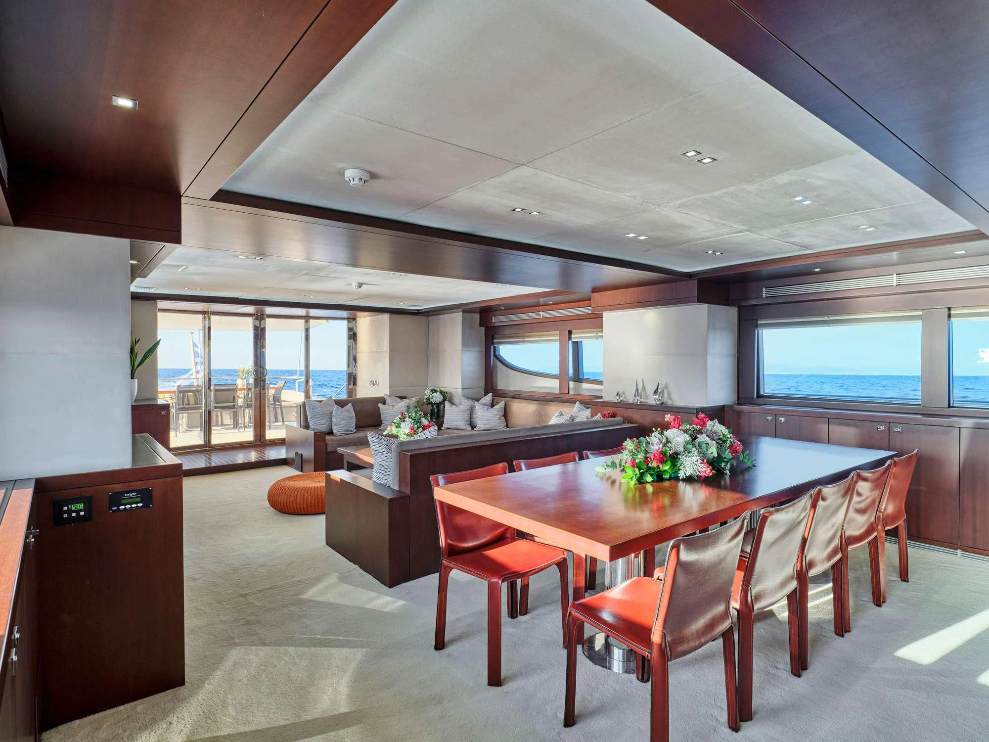 a large dining table in a room aboard SANJANA Yacht for Sale