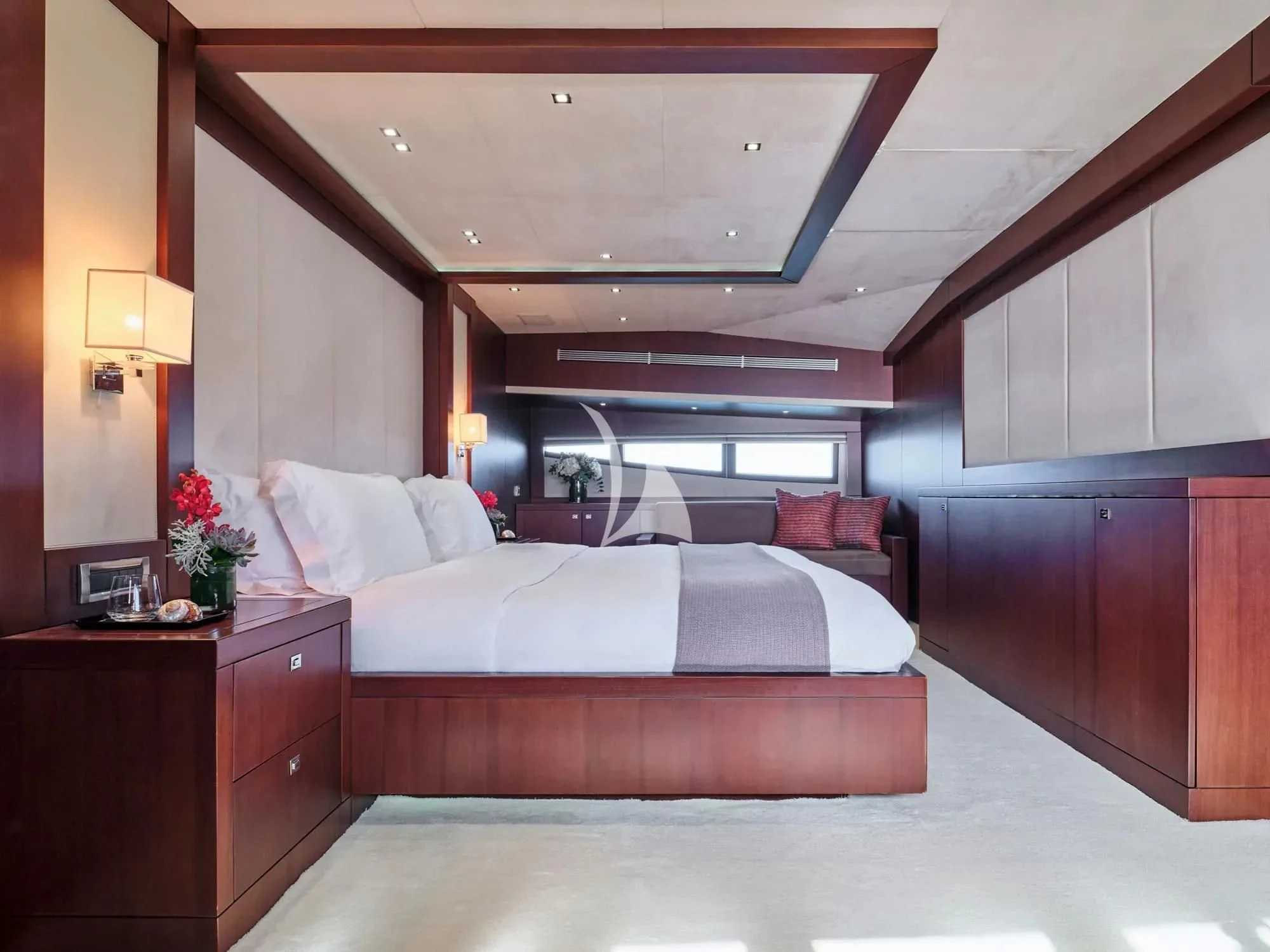 a bedroom with a bed and a desk aboard SANJANA Yacht for Sale