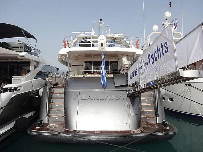 a large white boat with a blue stripe on the front aboard SANJANA Yacht for Sale