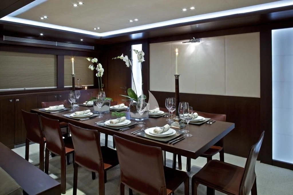 a dining table set for a dinner aboard SANJANA Yacht for Sale