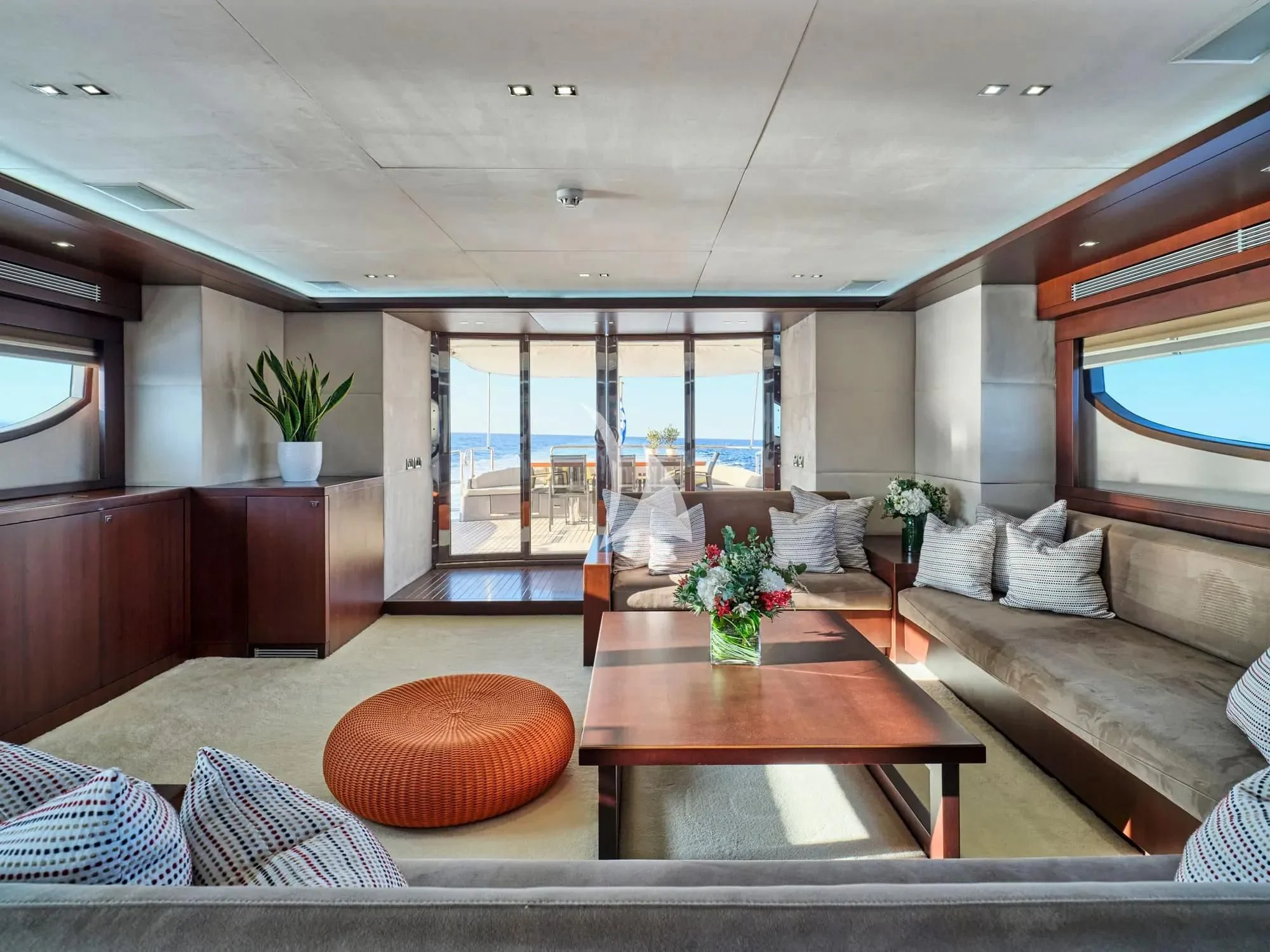 a living room with a large window aboard SANJANA Yacht for Sale