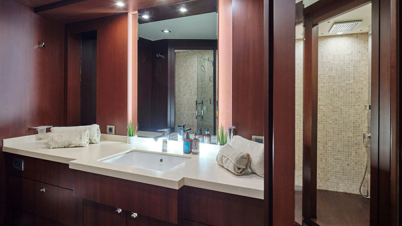 a bathroom with a sink and a mirror aboard SANJANA Yacht for Sale