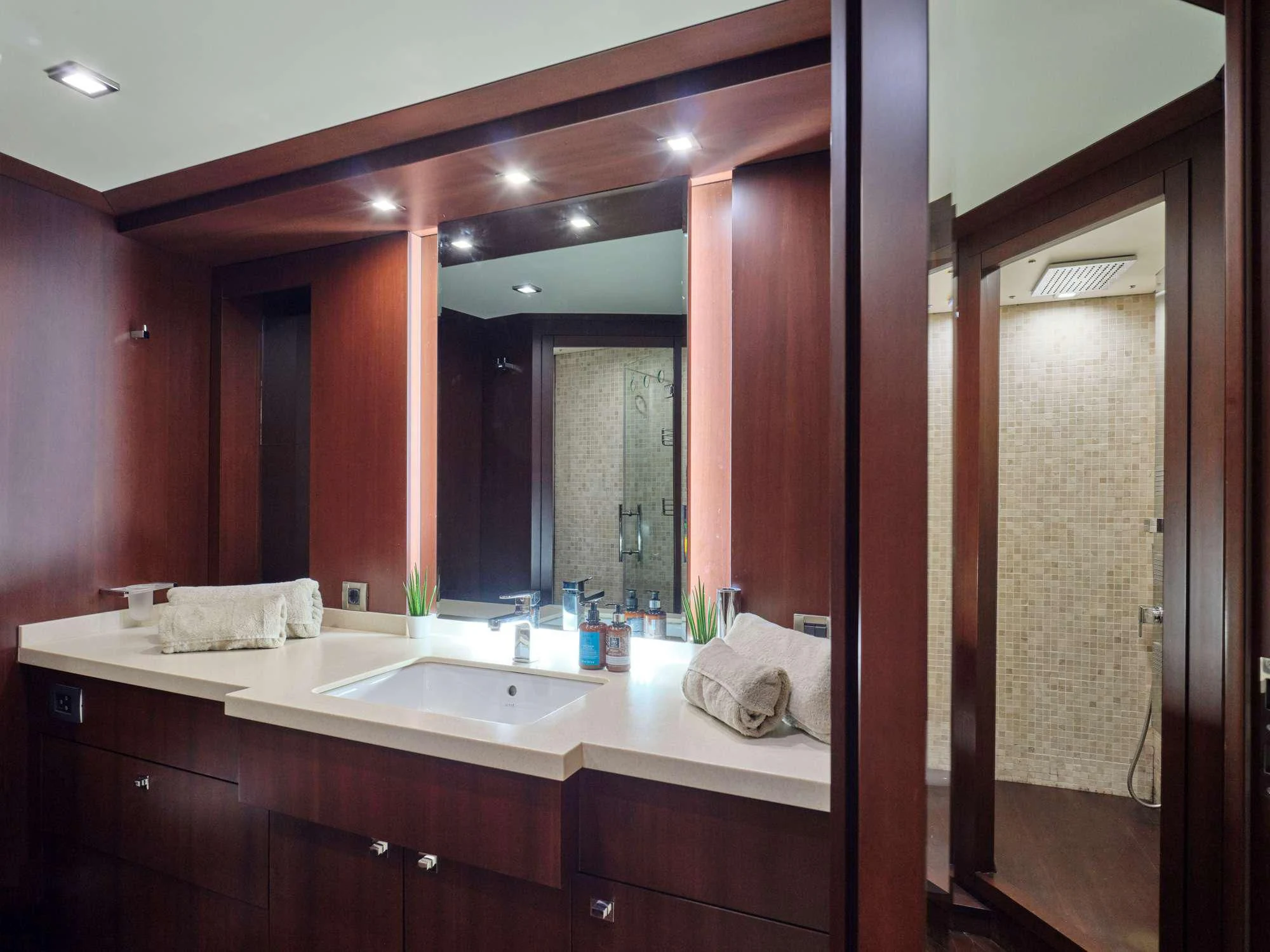 a bathroom with a large mirror aboard SANJANA Yacht for Sale
