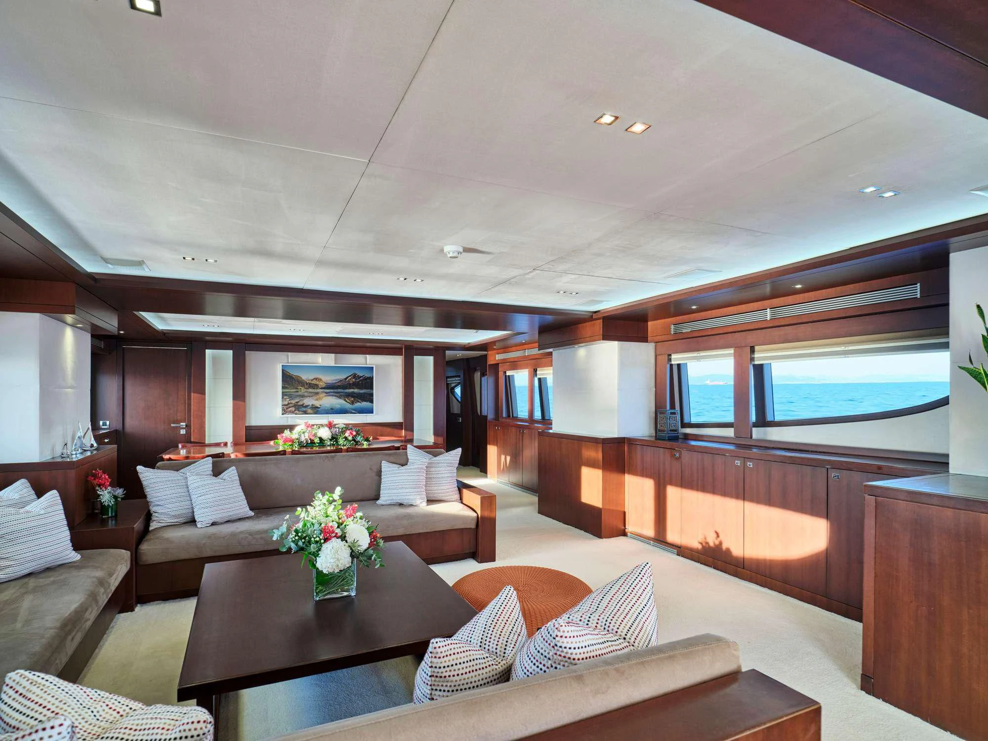a living room with a large window aboard SANJANA Yacht for Sale