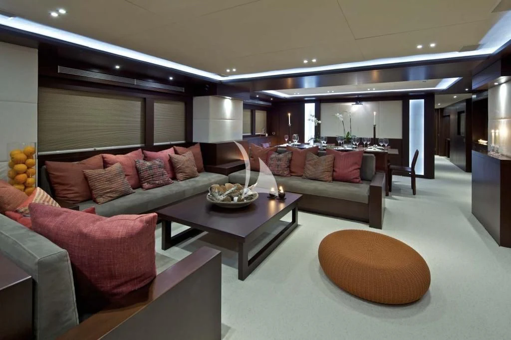 a living room with a couch and a coffee table aboard SANJANA Yacht for Sale