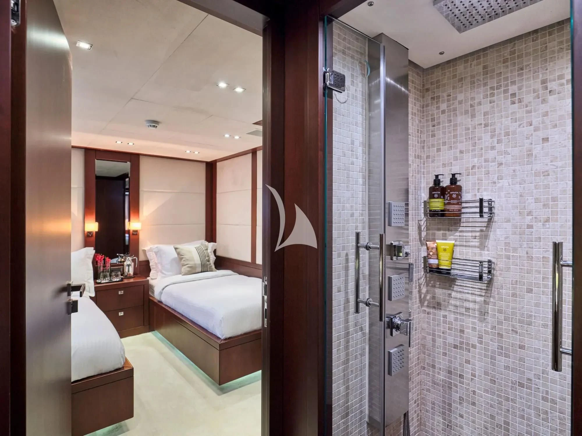 a room with a bed and a glass door aboard SANJANA Yacht for Sale