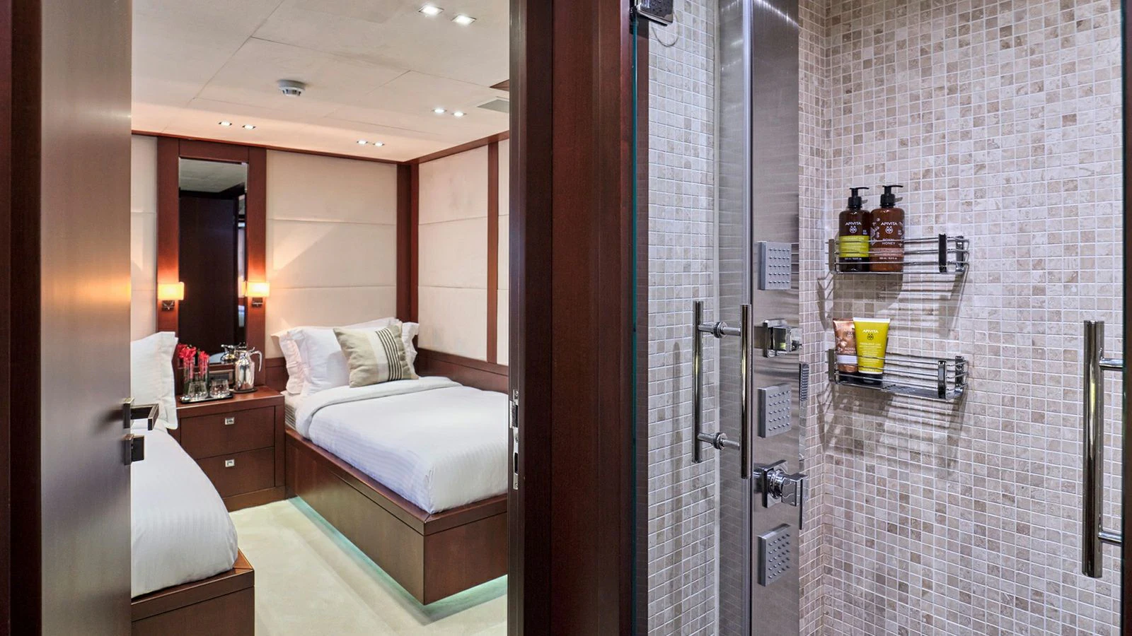 a room with a bed and a glass door aboard SANJANA Yacht for Sale