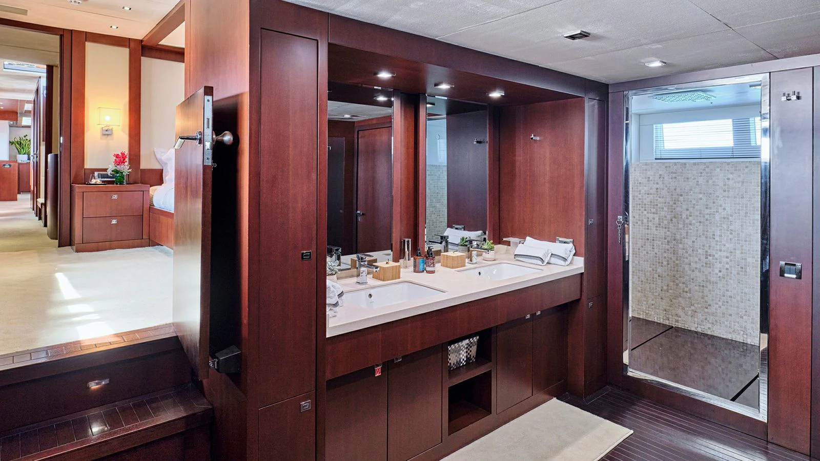 a bathroom with a large mirror aboard SANJANA Yacht for Sale