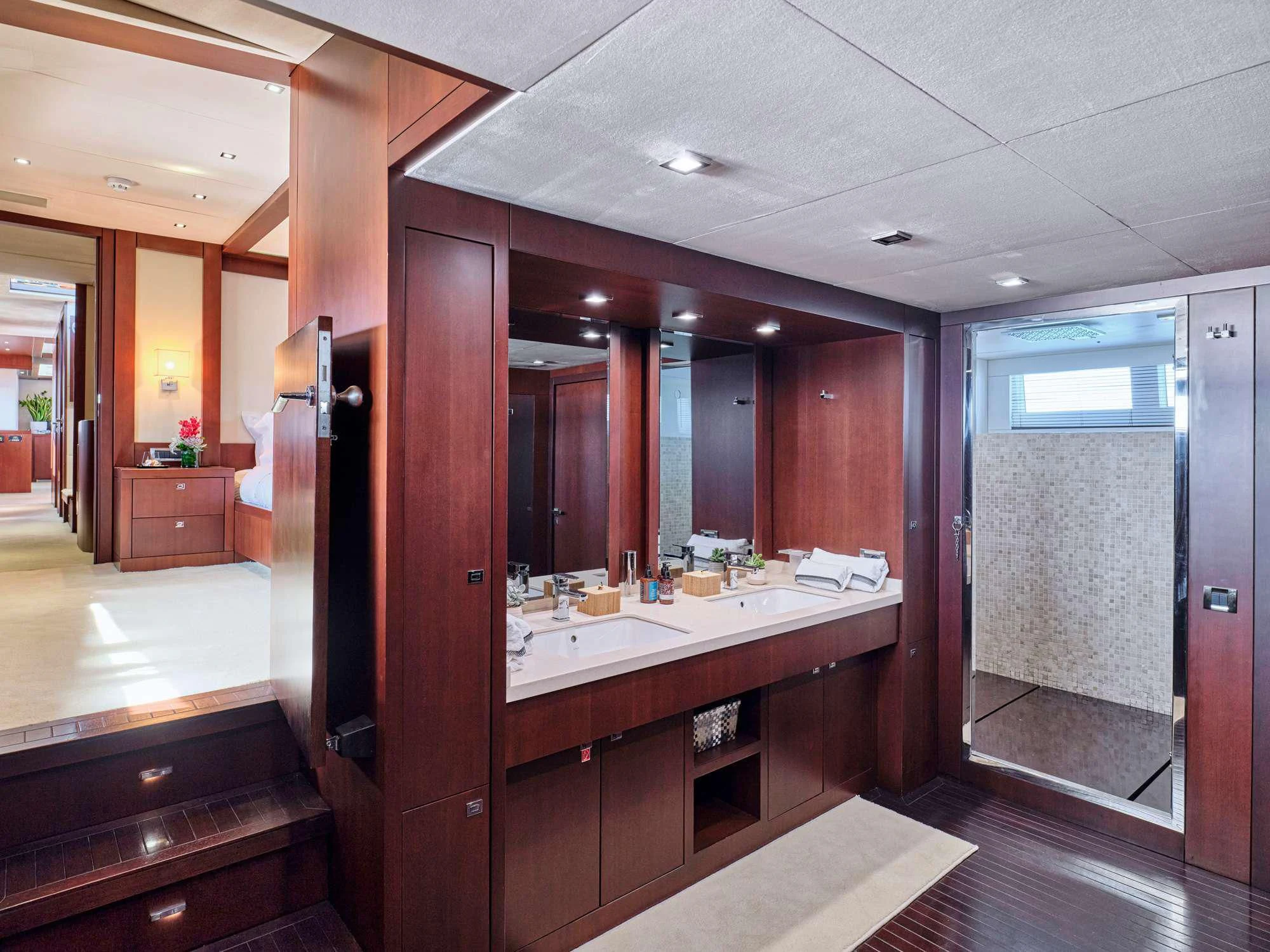 a bathroom with a large mirror aboard SANJANA Yacht for Sale