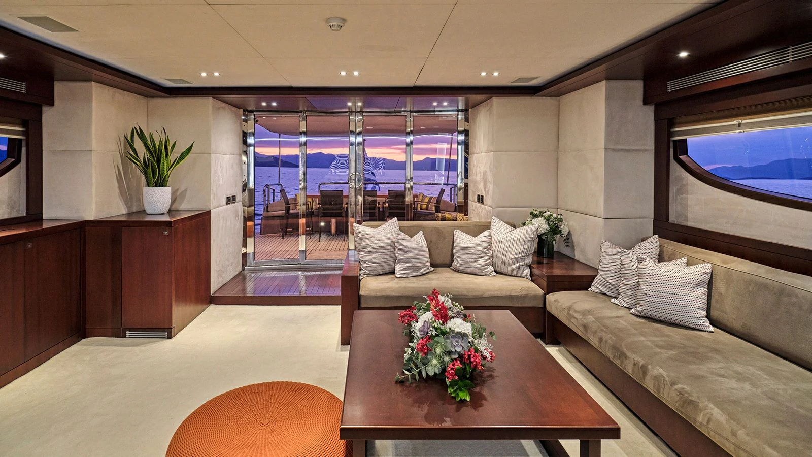 a living room with a large window aboard SANJANA Yacht for Sale