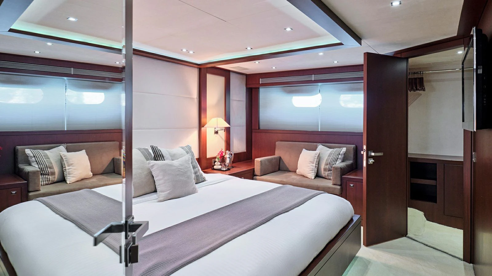 a room with a bed and a couch aboard SANJANA Yacht for Sale