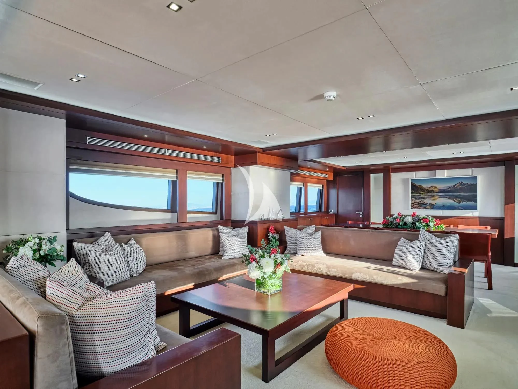 a living room with a couch and a coffee table aboard SANJANA Yacht for Sale