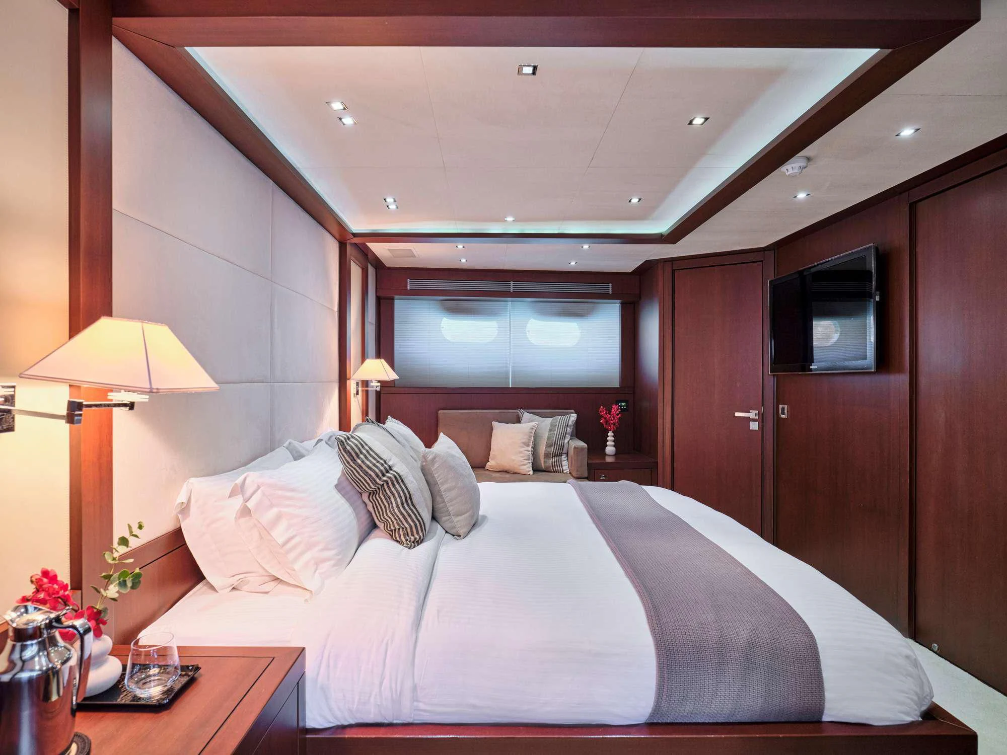 a bed with a white sheet and pillows aboard SANJANA Yacht for Sale