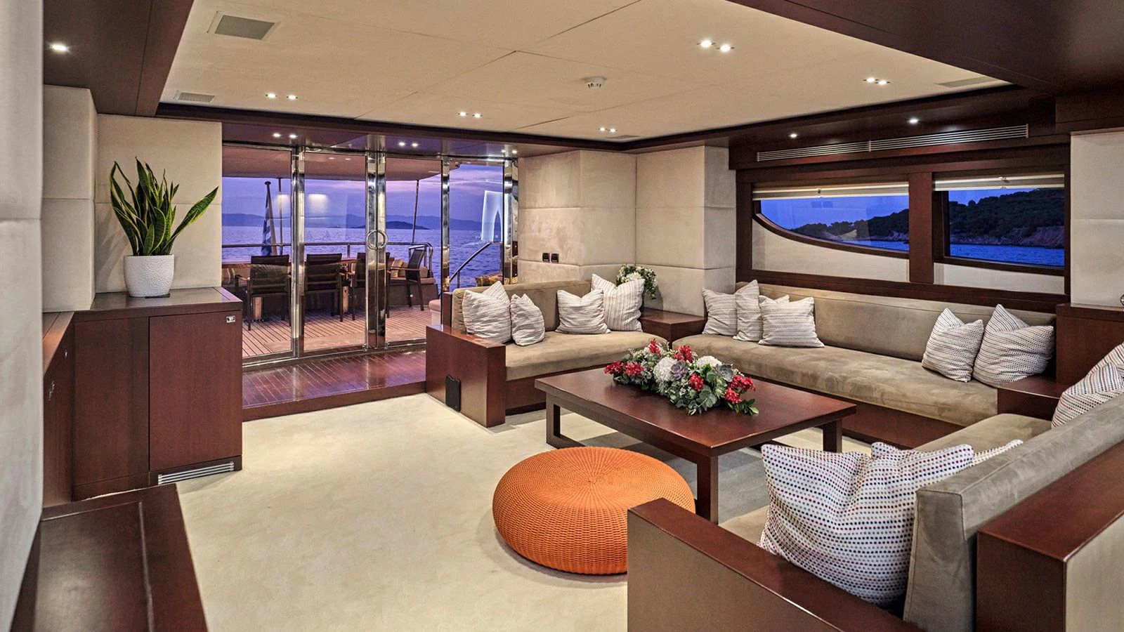 a living room with a couch and a coffee table aboard SANJANA Yacht for Sale