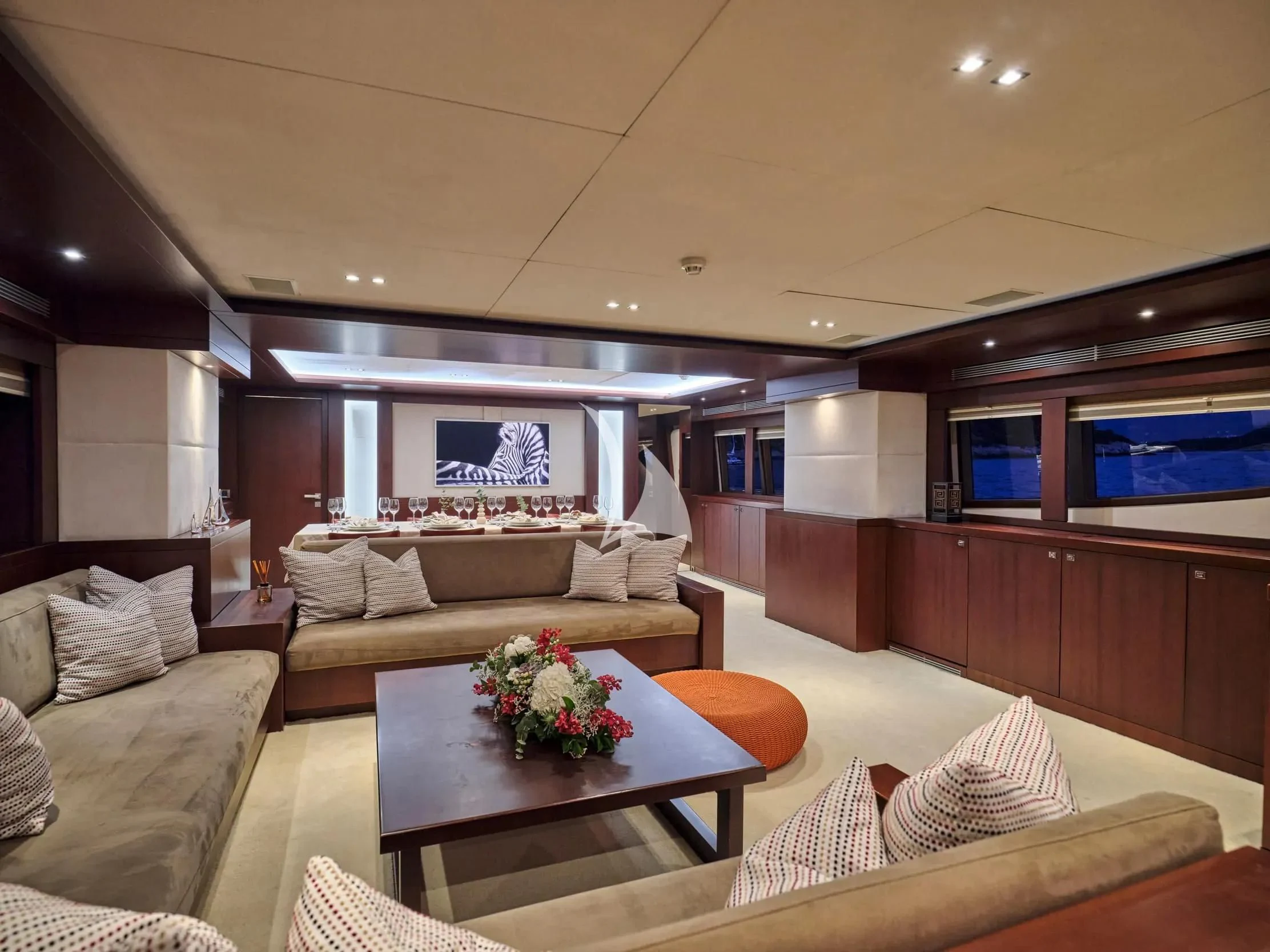 a living room with a couch and a television aboard SANJANA Yacht for Sale