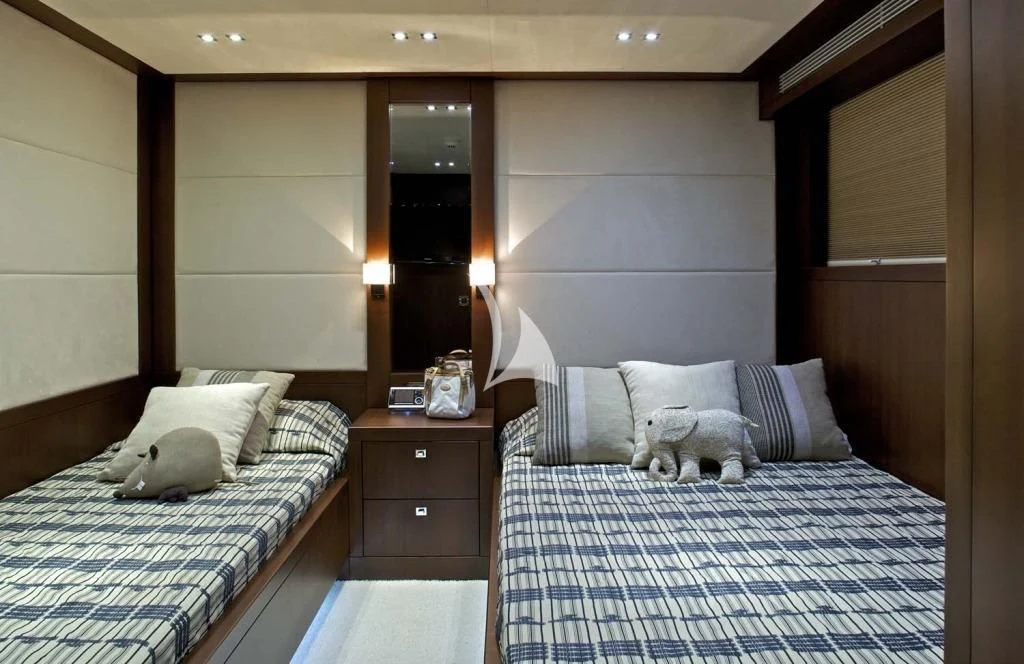 a bedroom with a bed and a dog aboard SANJANA Yacht for Sale