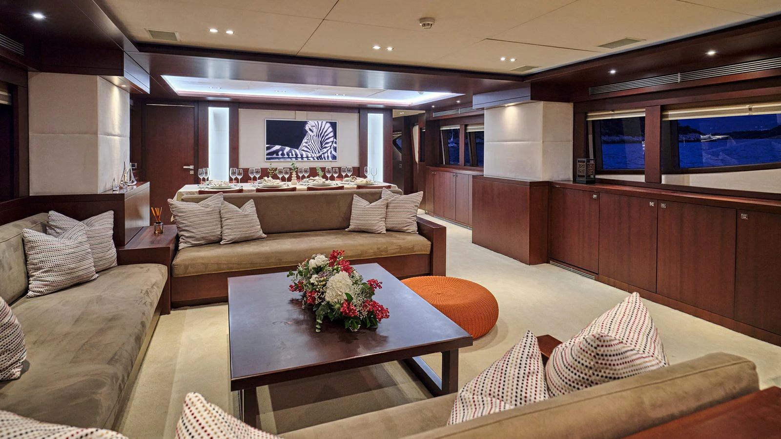 a living room with a couch and a coffee table aboard SANJANA Yacht for Sale