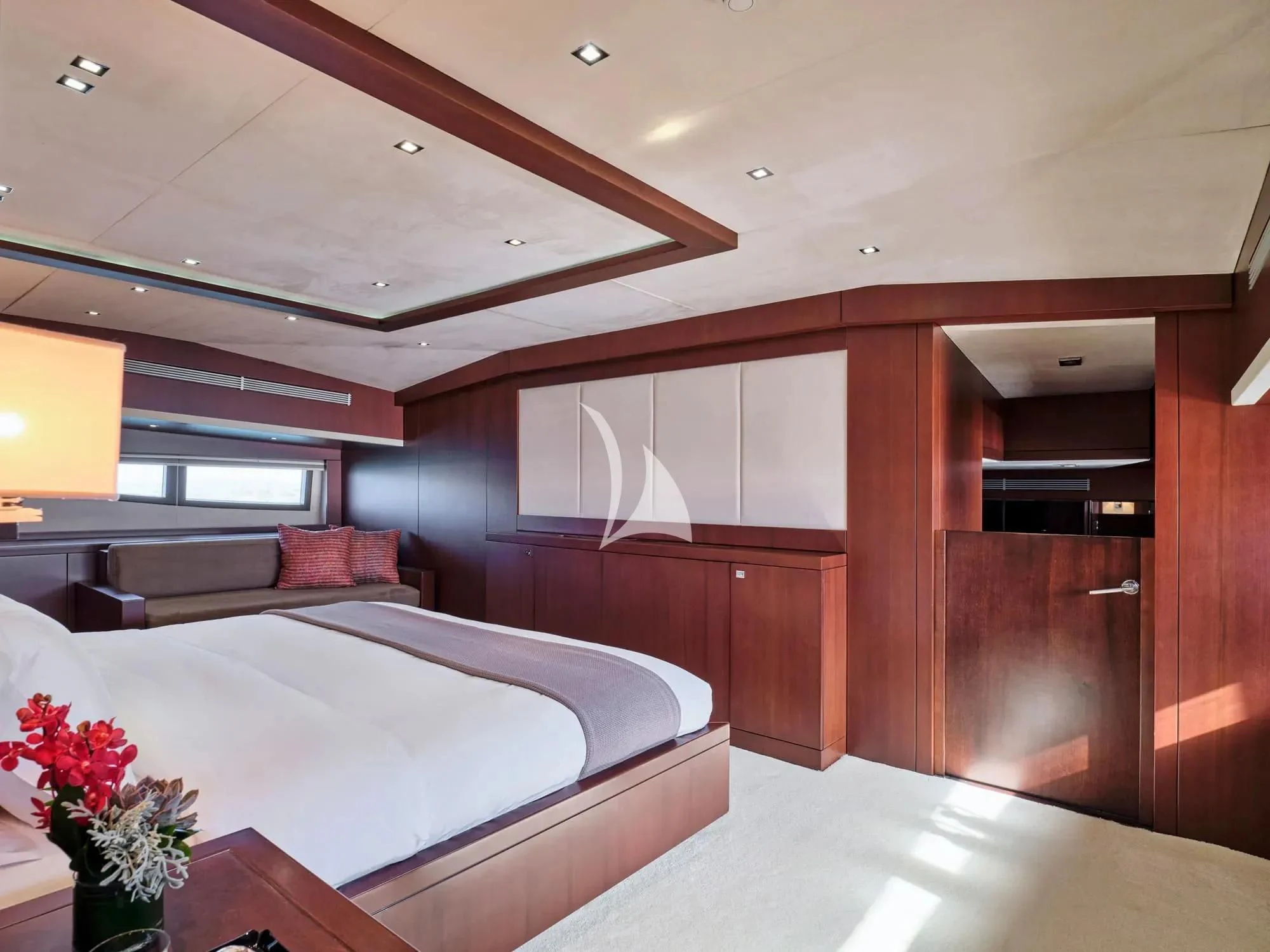a bedroom with a large bed aboard SANJANA Yacht for Sale