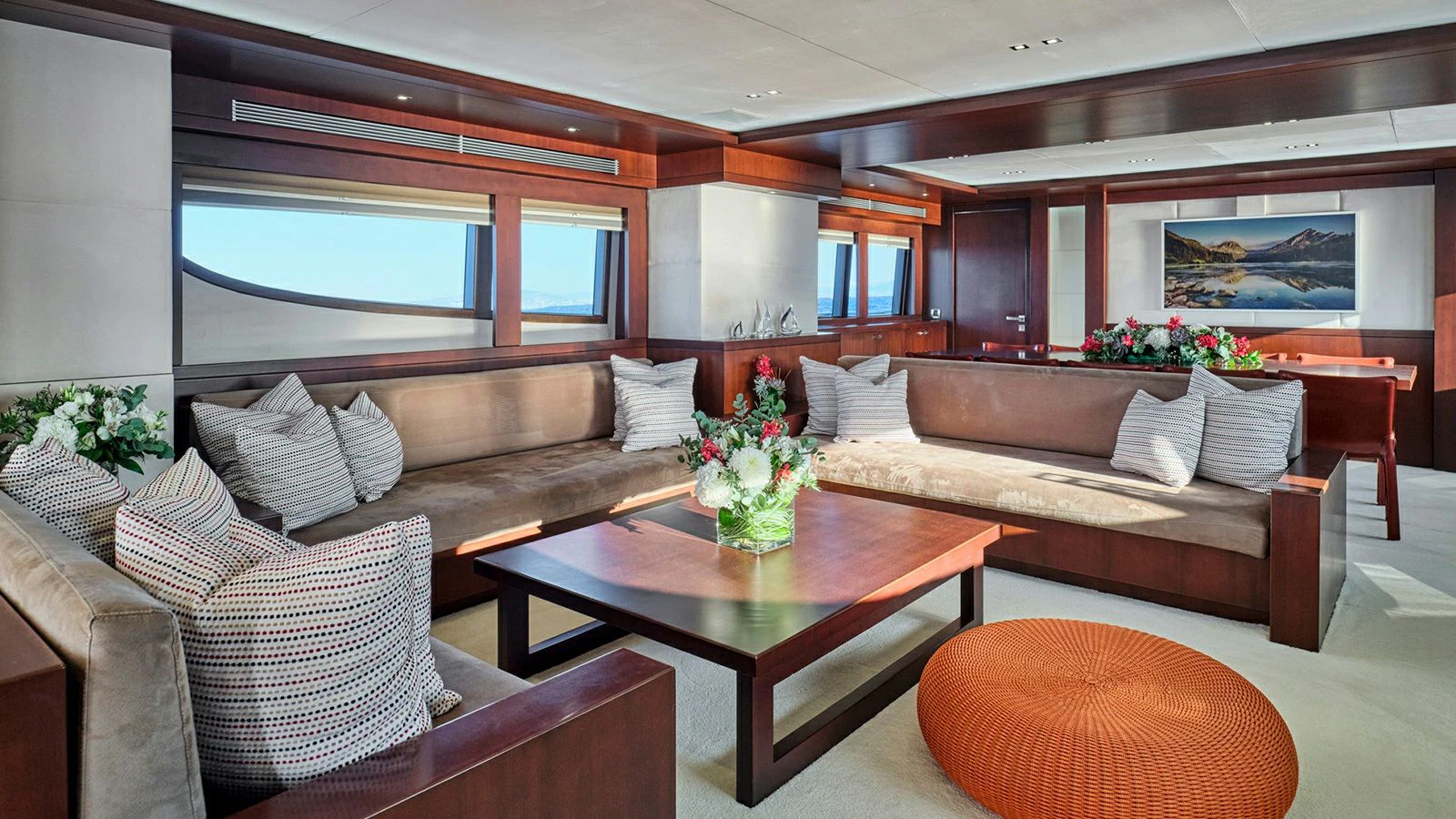 a living room with a couch and a coffee table aboard SANJANA Yacht for Sale
