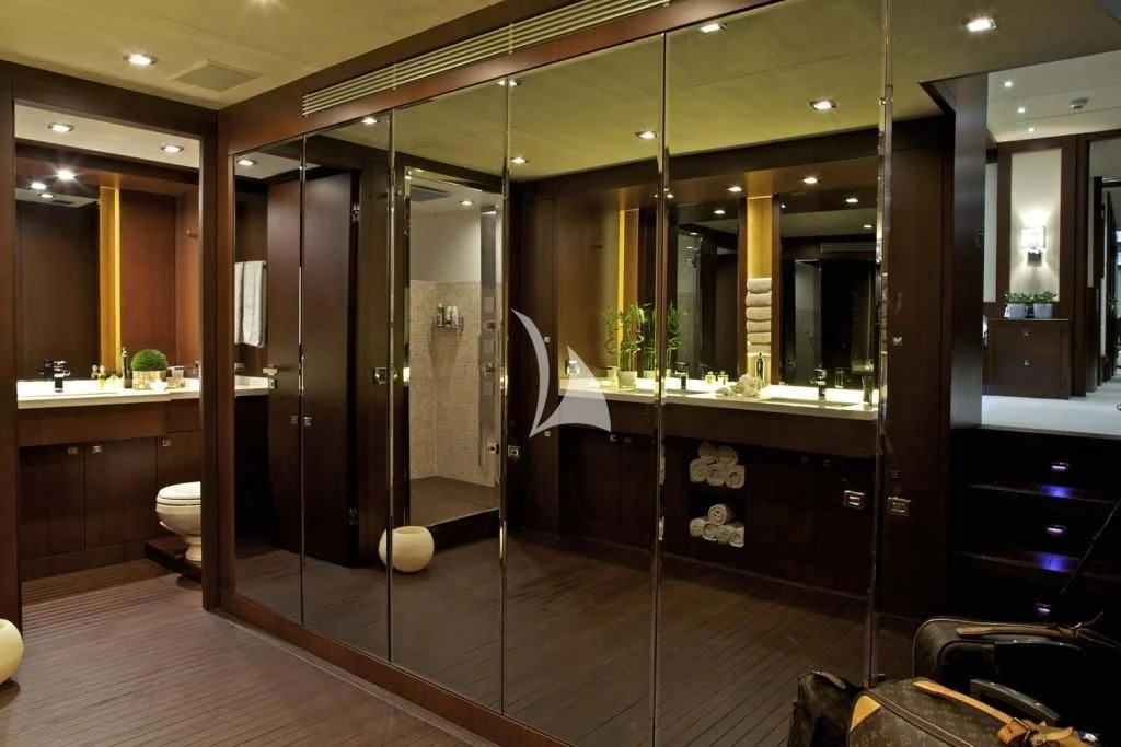 a bathroom with a large mirror aboard SANJANA Yacht for Sale