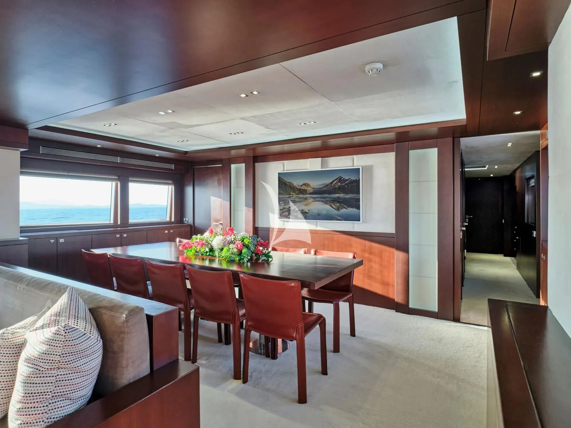 a room with a table and chairs aboard SANJANA Yacht for Sale