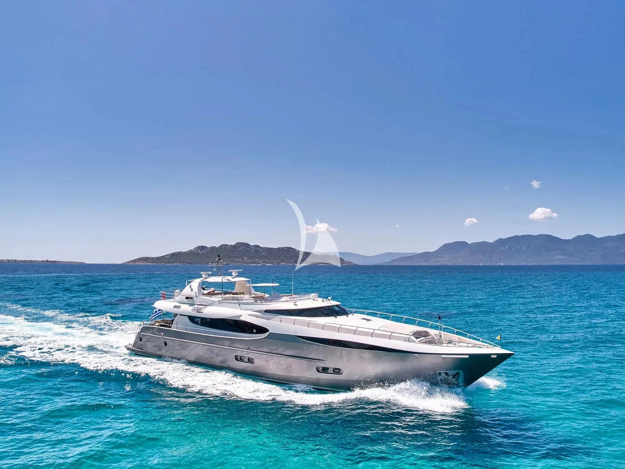 a boat in the water with a white bird flying over it aboard SANJANA Yacht for Sale