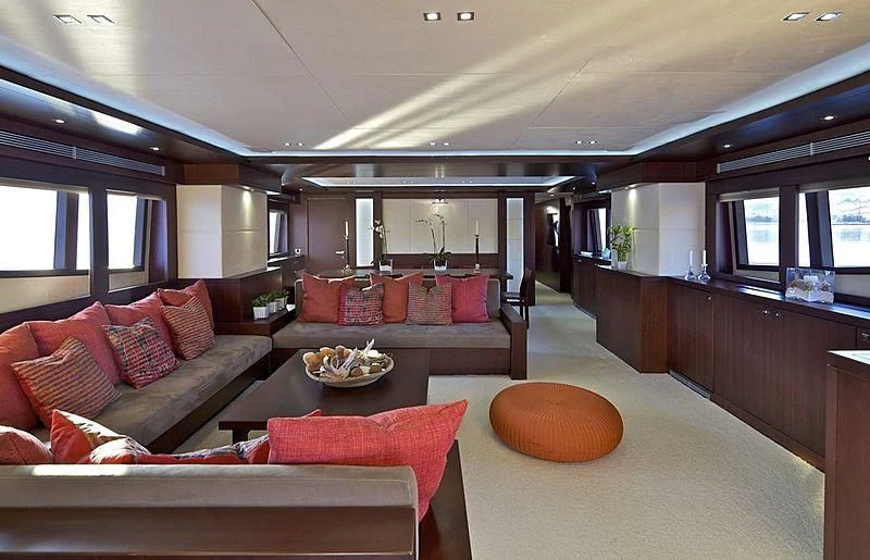 a living room with a couch and a table aboard SANJANA Yacht for Sale