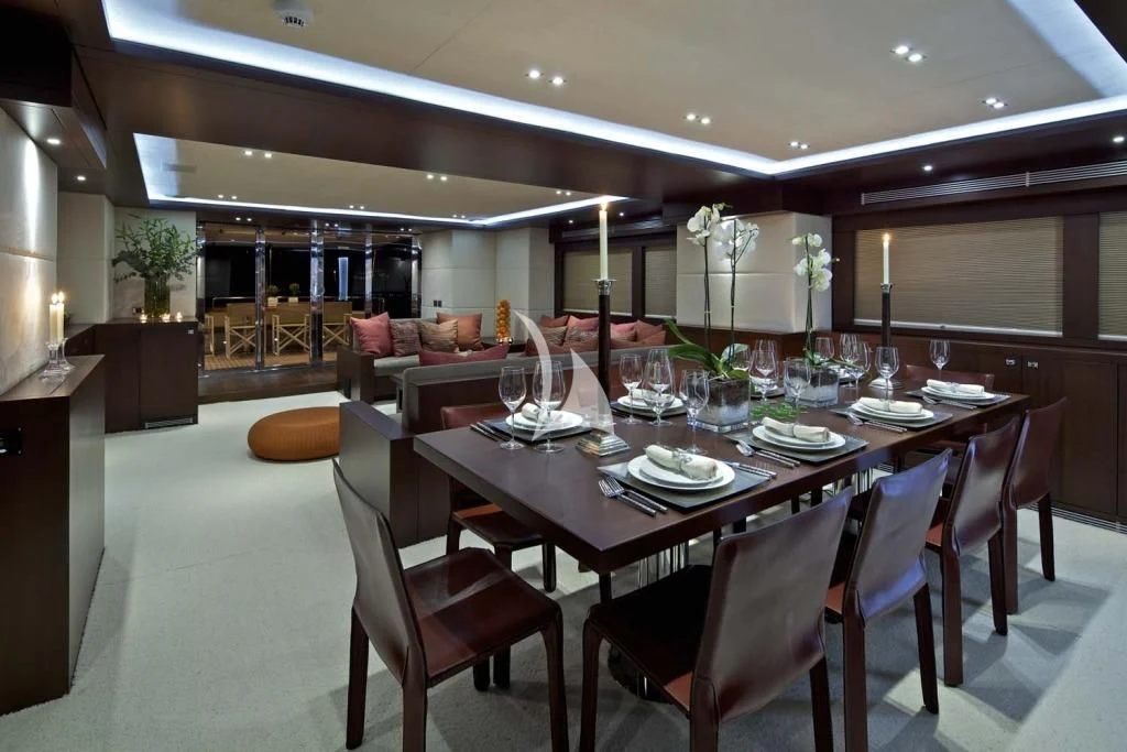 a dining room with a table and chairs aboard SANJANA Yacht for Sale