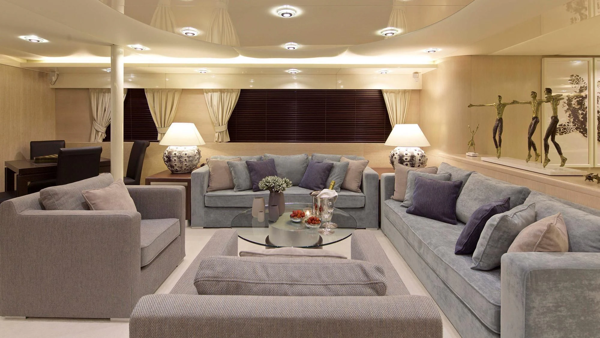 a living room with a couch and a coffee table aboard MAGIX Yacht for Sale
