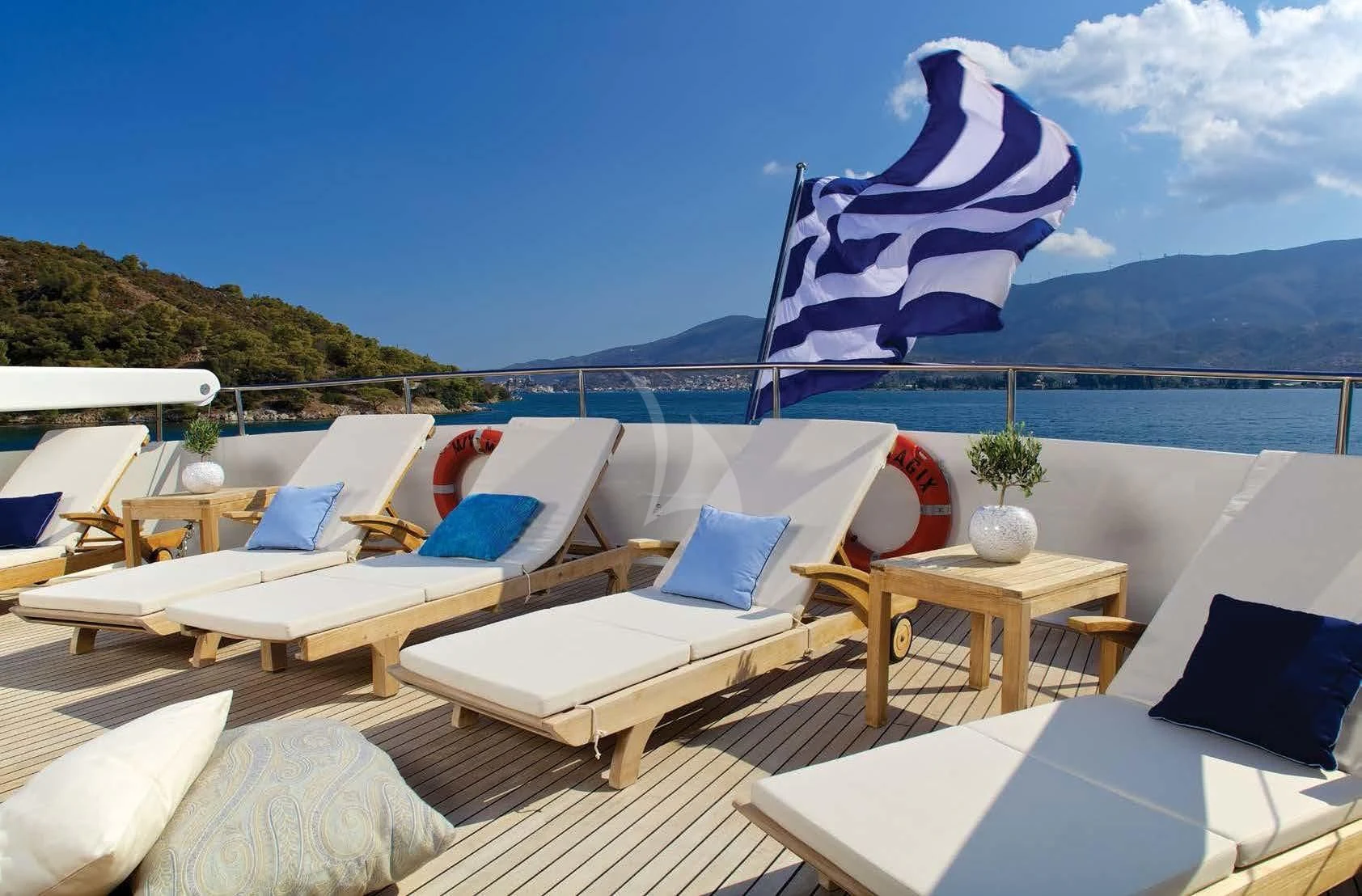 a deck with chairs and tables on it aboard MAGIX Yacht for Sale