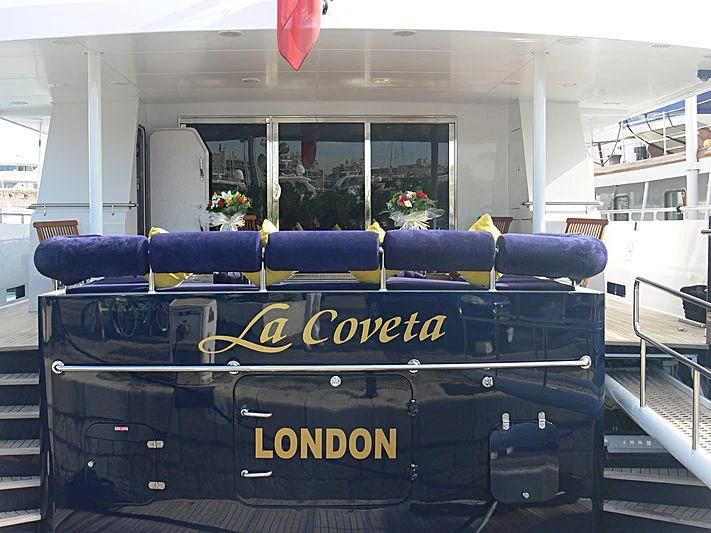 a blue and black vehicle with yellow text on it aboard MAGIX Yacht for Sale