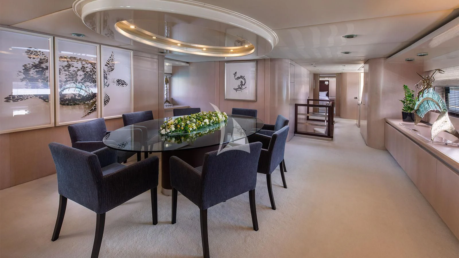 a large room with a table and chairs aboard MAGIX Yacht for Sale