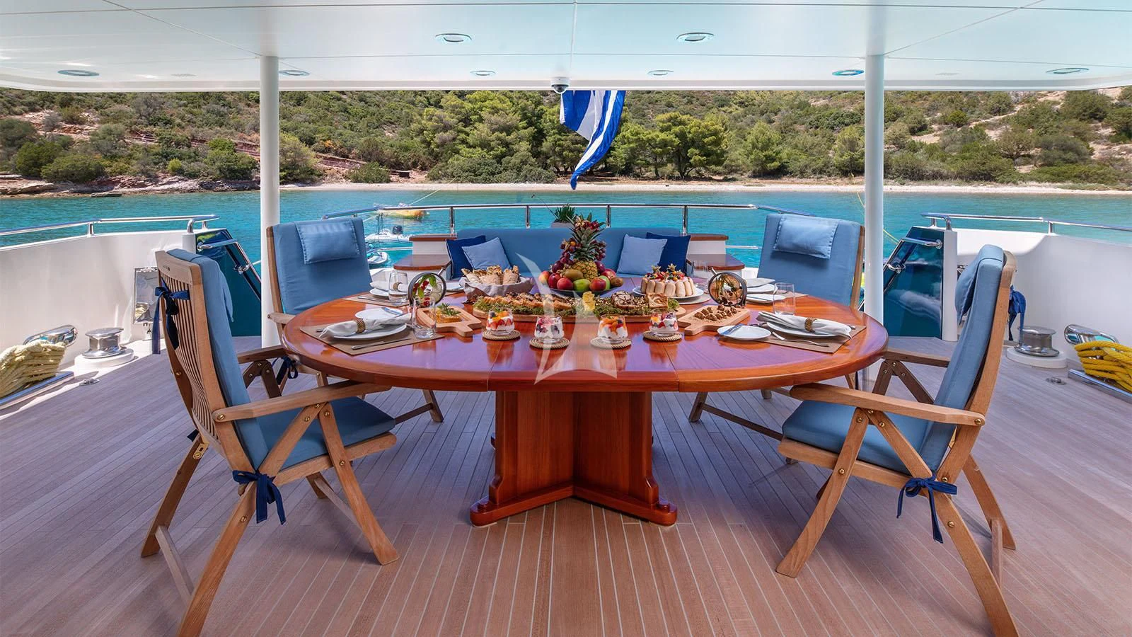 a table set for a meal on a deck aboard MAGIX Yacht for Sale
