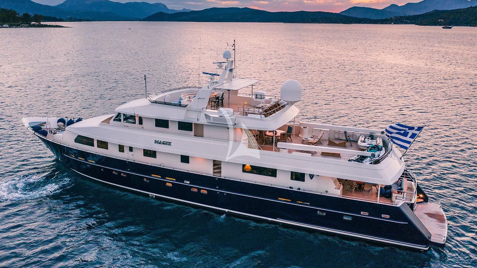 a large white ship in the water aboard MAGIX Yacht for Sale