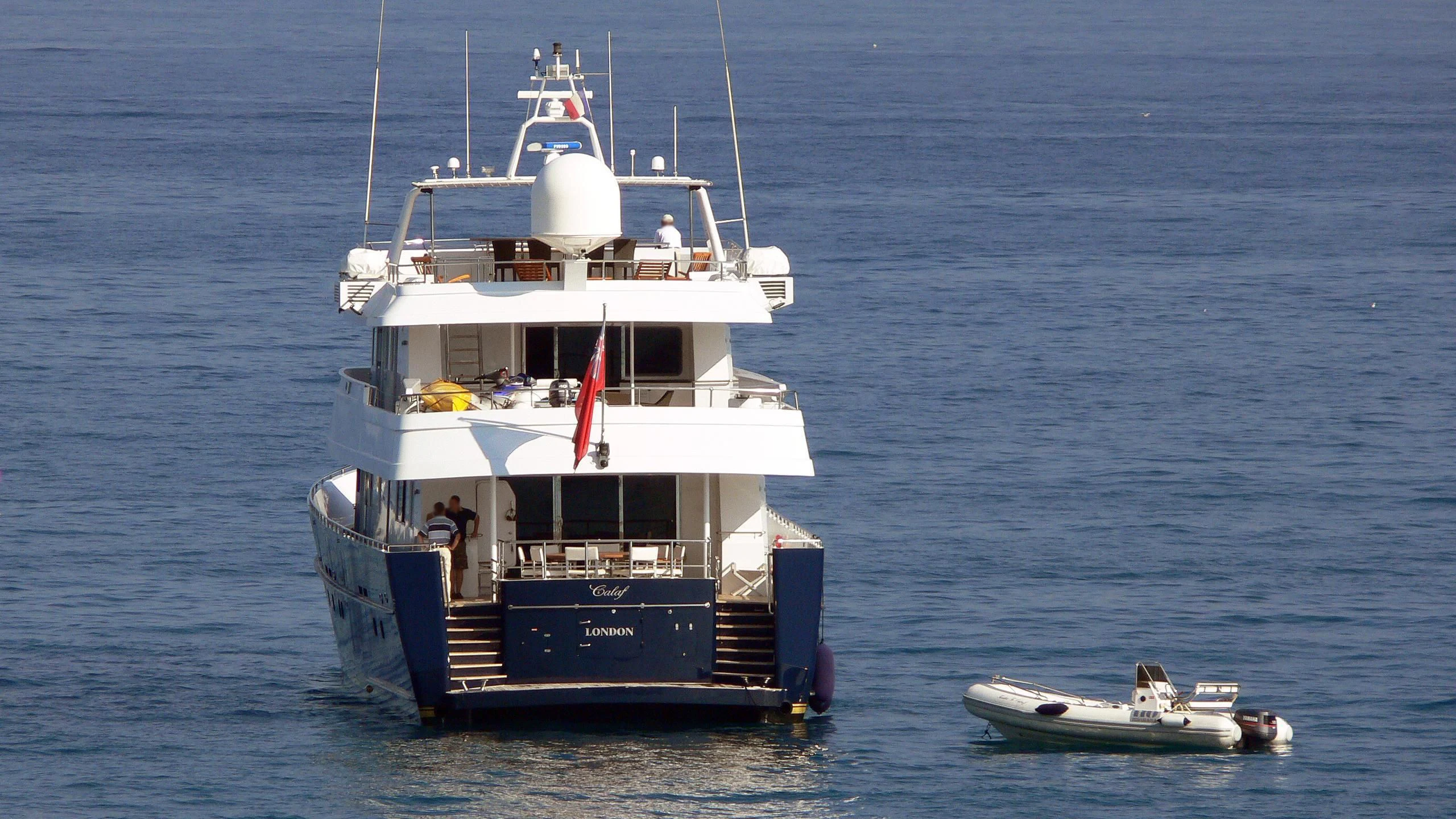 a boat with a flag on it aboard MAGIX Yacht for Sale