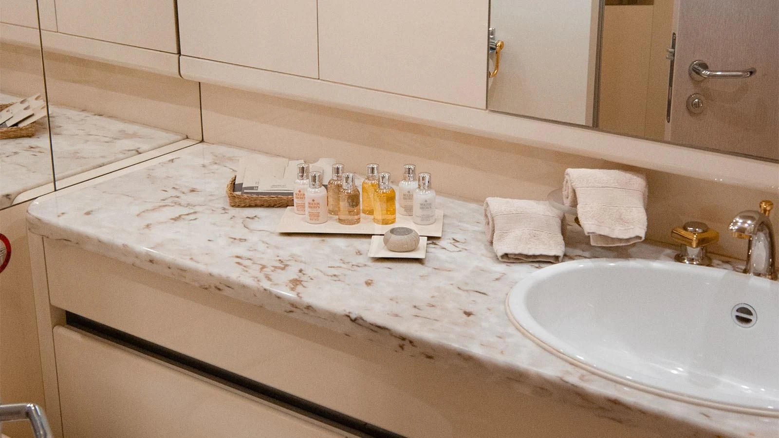 a bathroom counter with a sink and mirror aboard MAGIX Yacht for Sale