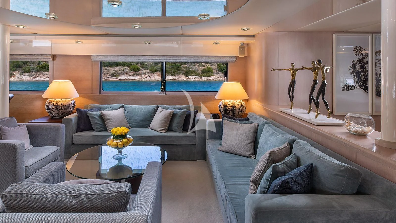 a living room with couches and a table aboard MAGIX Yacht for Sale