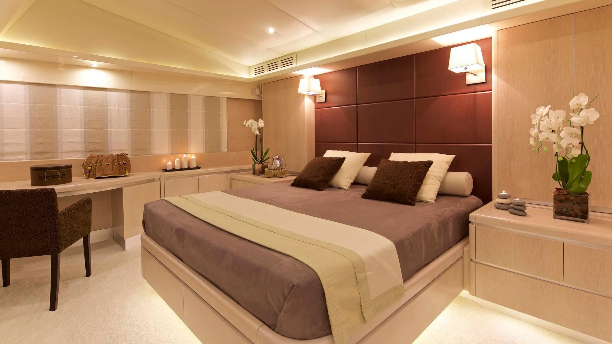 a room with a bed and a desk aboard MAGIX Yacht for Sale