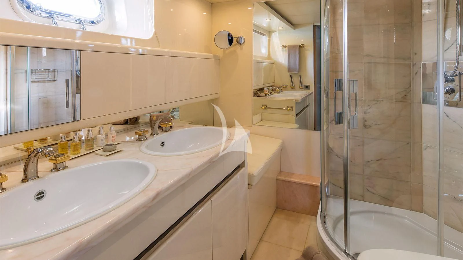 a bathroom with a shower and sinks aboard MAGIX Yacht for Sale